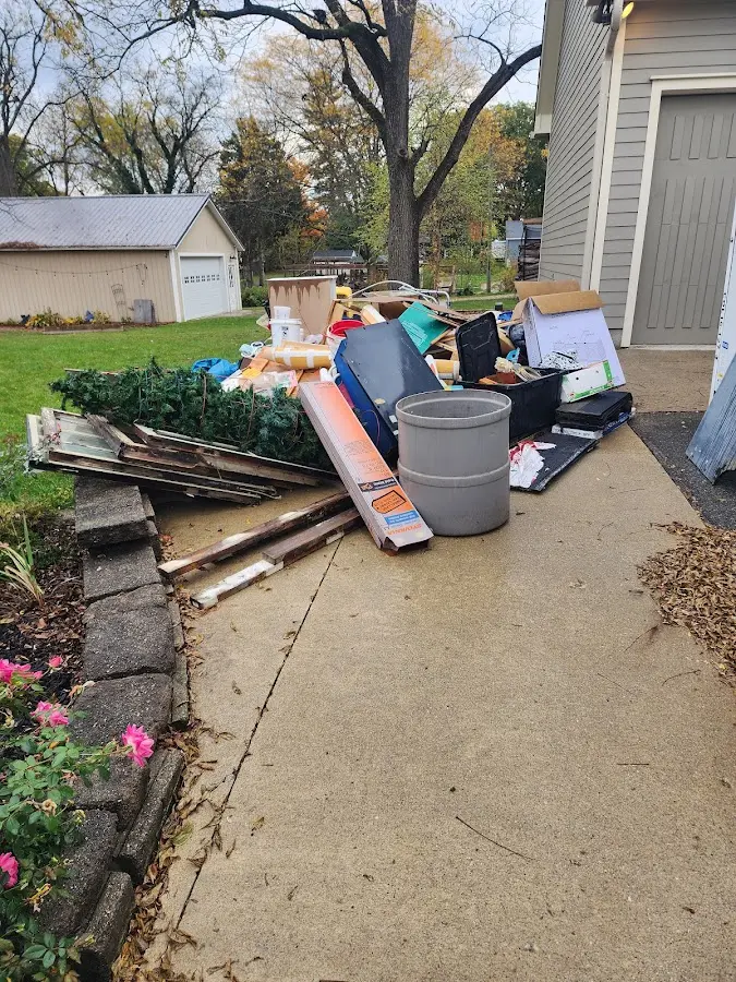 Dumpster being loaded with debris for Commercial Dumpster Rental in Sandown